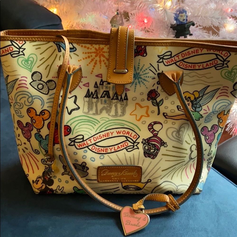 Dooney & Bourke cream colored Disney bag